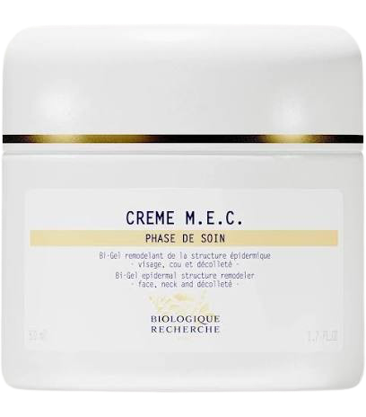 White jar of Crème M.E.C. with gold accents on a white background