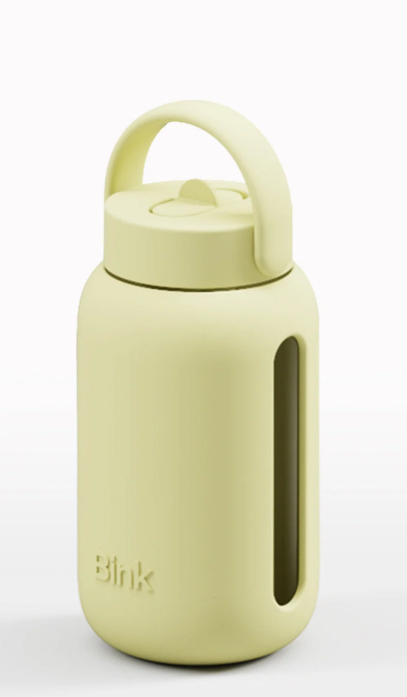 Light green water bottle with a handle on a white background