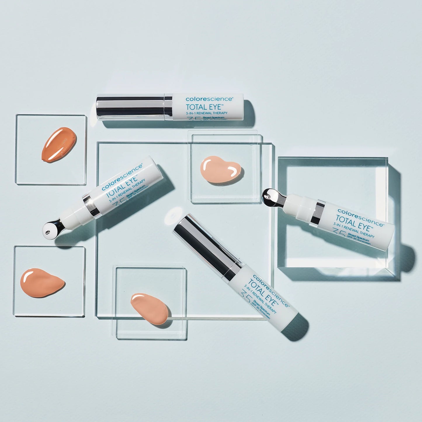 Cosmetic products with visible brand name on a light blue background