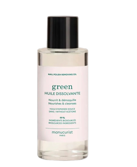 Bottle of nail polish removing oil with 'green' label on a white background