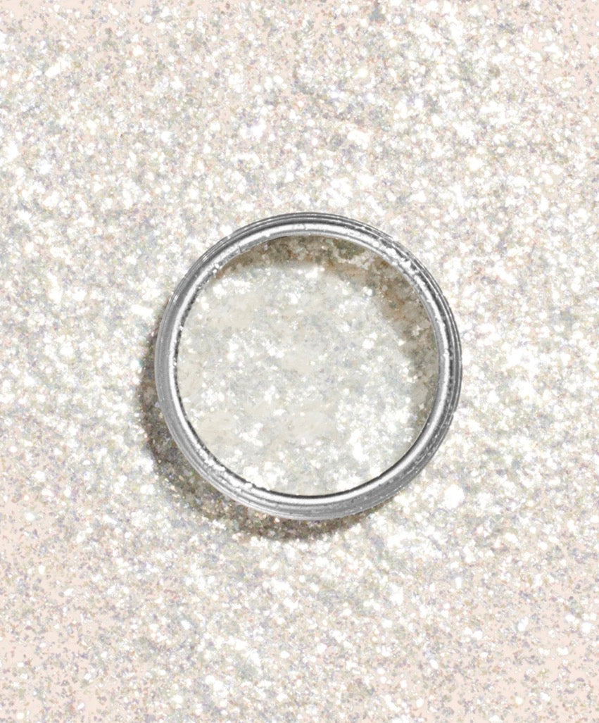 Silver ring on a glittery white background