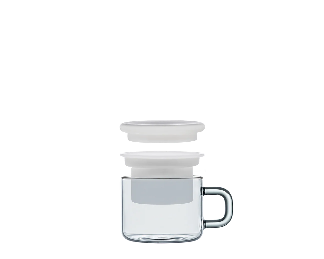 Clear glass mug with white lid on a white background