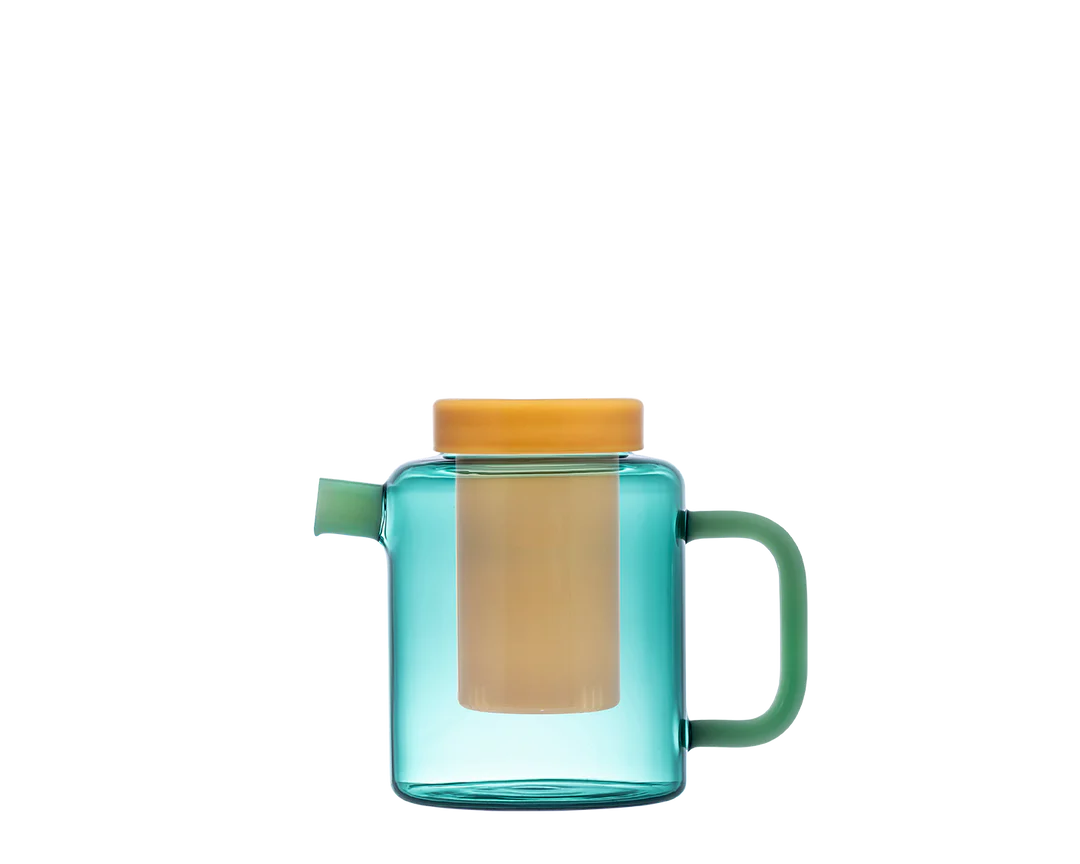Turquoise glass mug with a yellow lid and handle on a white background