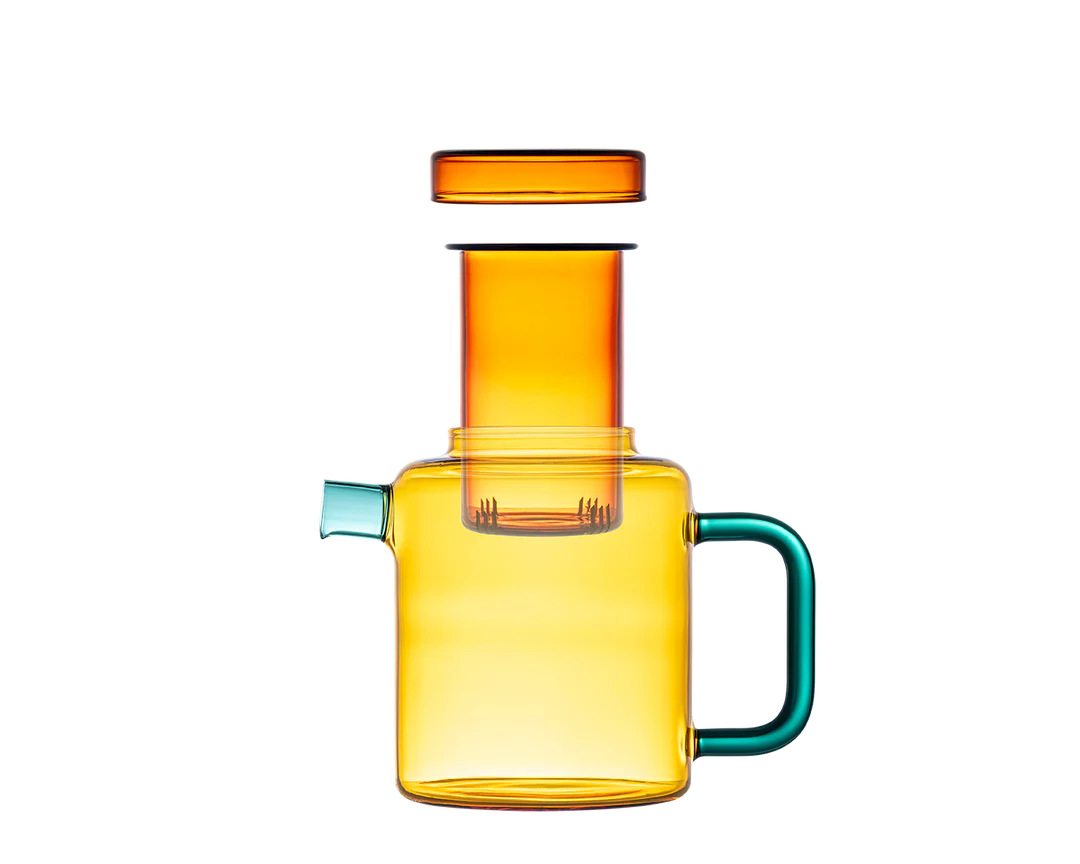 Colorful glass carafe with a handle on a white background
