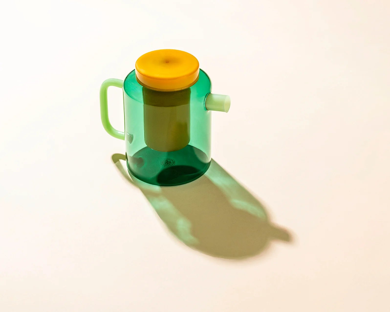 Green and yellow plastic container on a white background